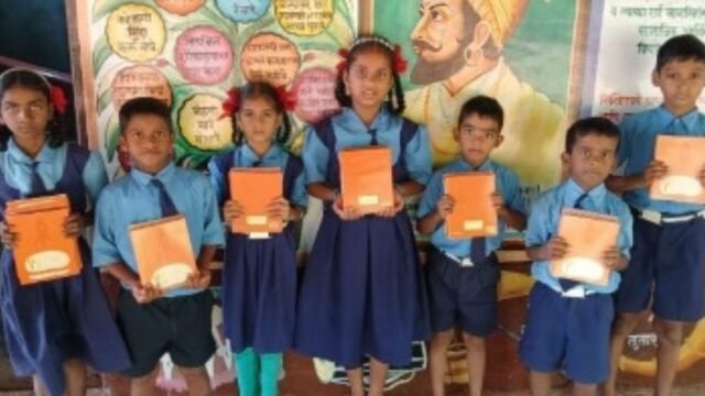 Notebook distribution program organized by the Ozar Alumni Association held at Sablewadi School.